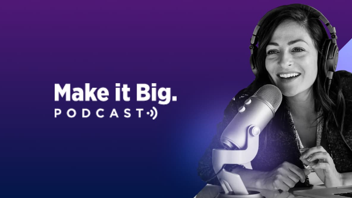 Make it big podcast logo with person at desk and microphone 